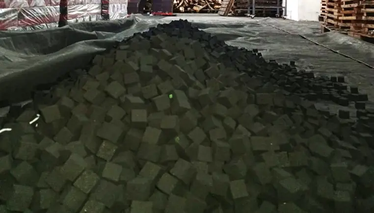 Cooling process for charcoal briquettes after oven drying